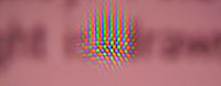 CRT screen with water droplet magnifying the phosphor dots for pink