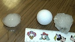 Photo: hailstones with golf ball and ruler
